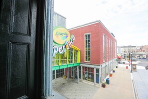 A Crayola store with a red brick facade and large windows.