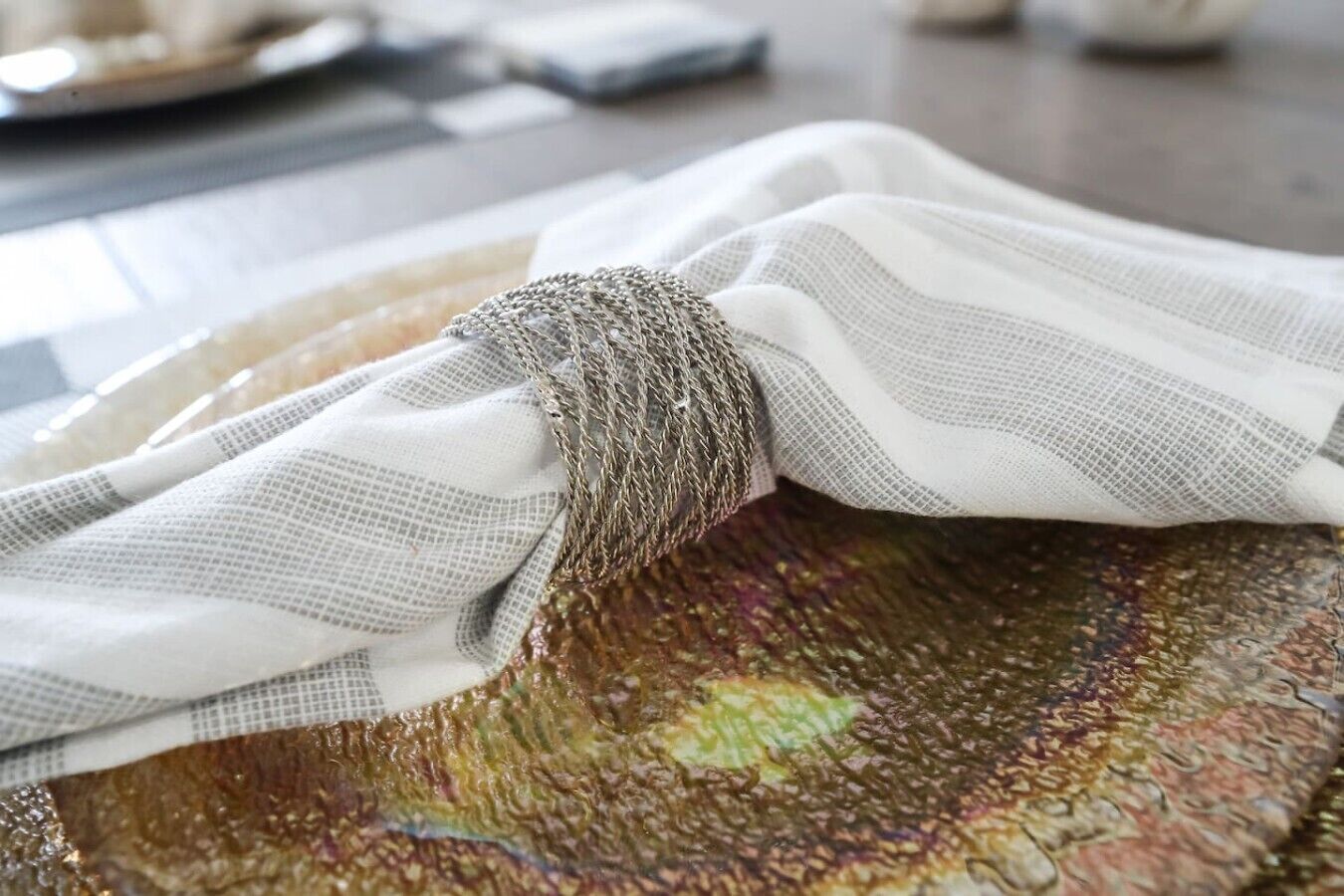 A patterned fabric with a textured design, possibly a tablecloth or decorative item.
