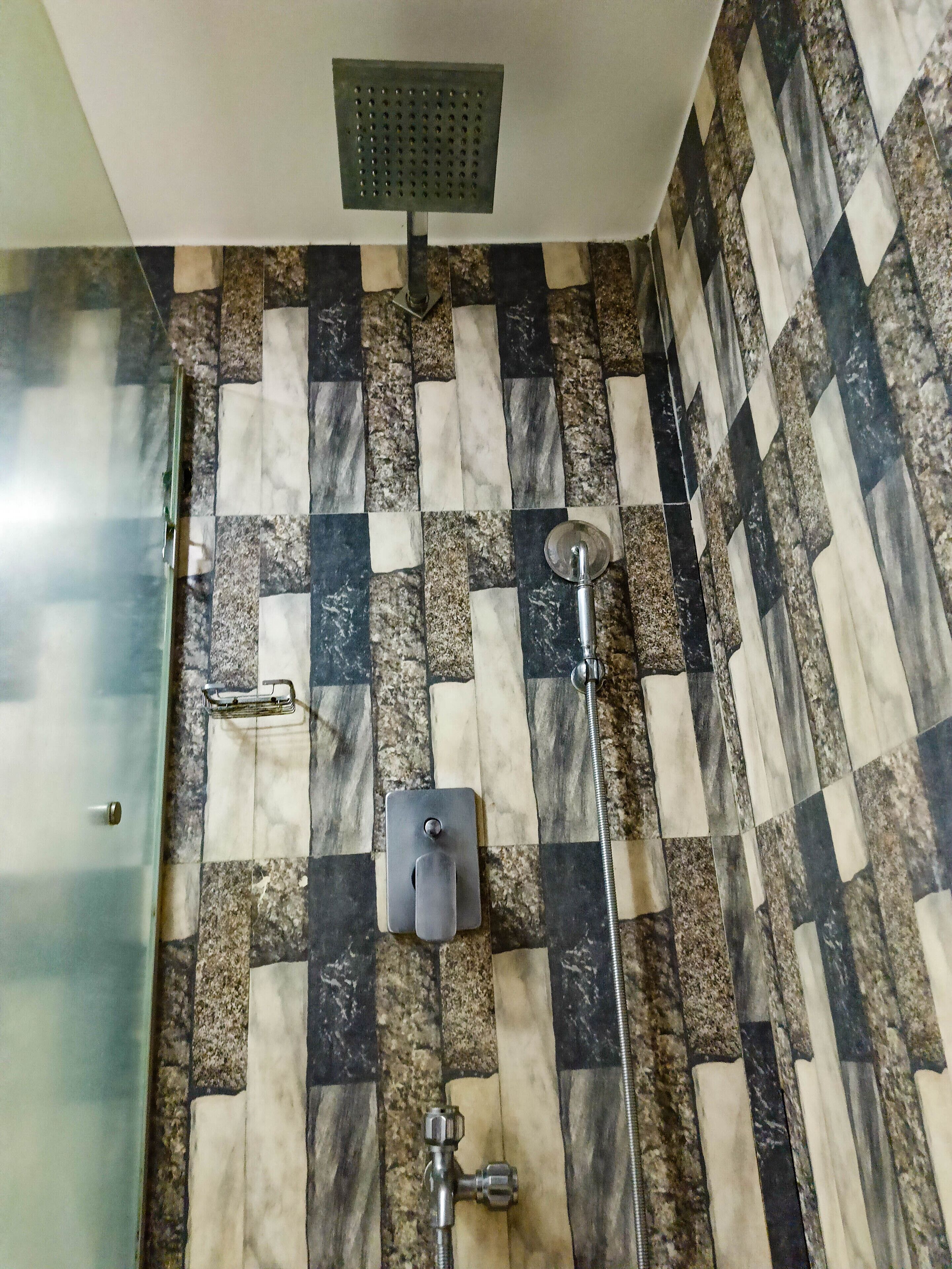 deluxe double room | bathroom | rainfall showerhead, designer toiletries, towels, soap