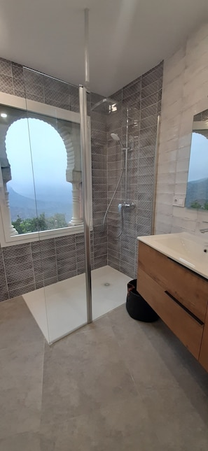 Shower, hair dryer, towels, toilet paper