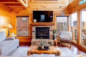 TV, fireplace - Dog Friendly Cabin, Hot Tub, 10 Mins to Dollywood   |   3 Decks with Views, Sleeps 10, Near Pigeon Forge & Smoky Mountains, Cozy Living Space, 24/7 Support (Sevierville)