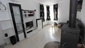 Romantic Apartment | Living area | 80-cm Smart TV with cable channels, TV, DVD player