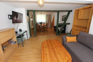 Comfort Apartment | Living area | 80-cm Smart TV with cable channels, TV, DVD player