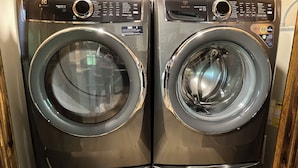 A pair of modern, stainless steel front-loading washing machines with digital control panels. - Well maintained cabin bordering national forest, close to Augusta, GA - -Masters (Edgefield)