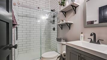 Shower, hair dryer, towels, soap