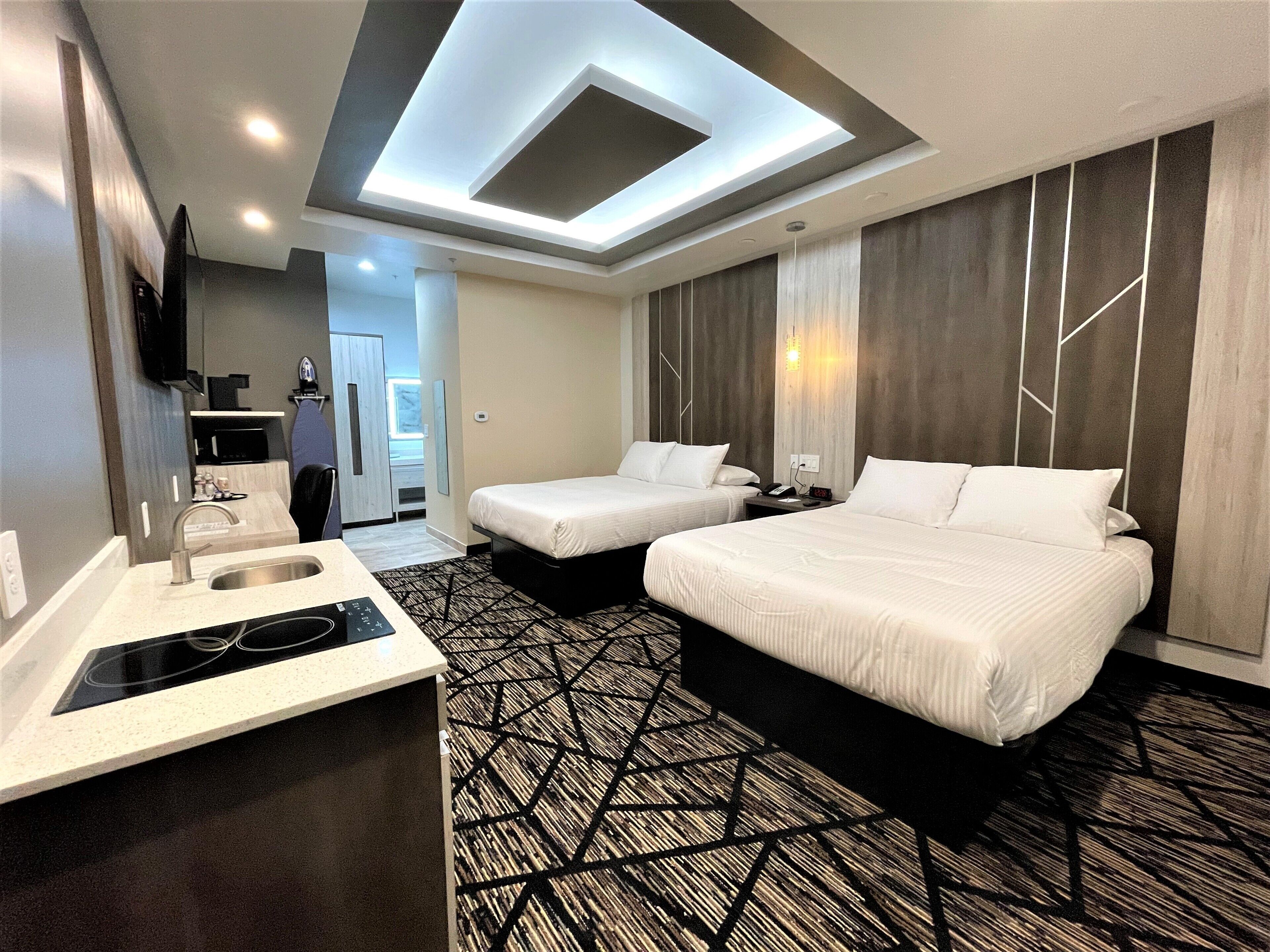 Desk, laptop workspace, blackout drapes, iron/ironing board