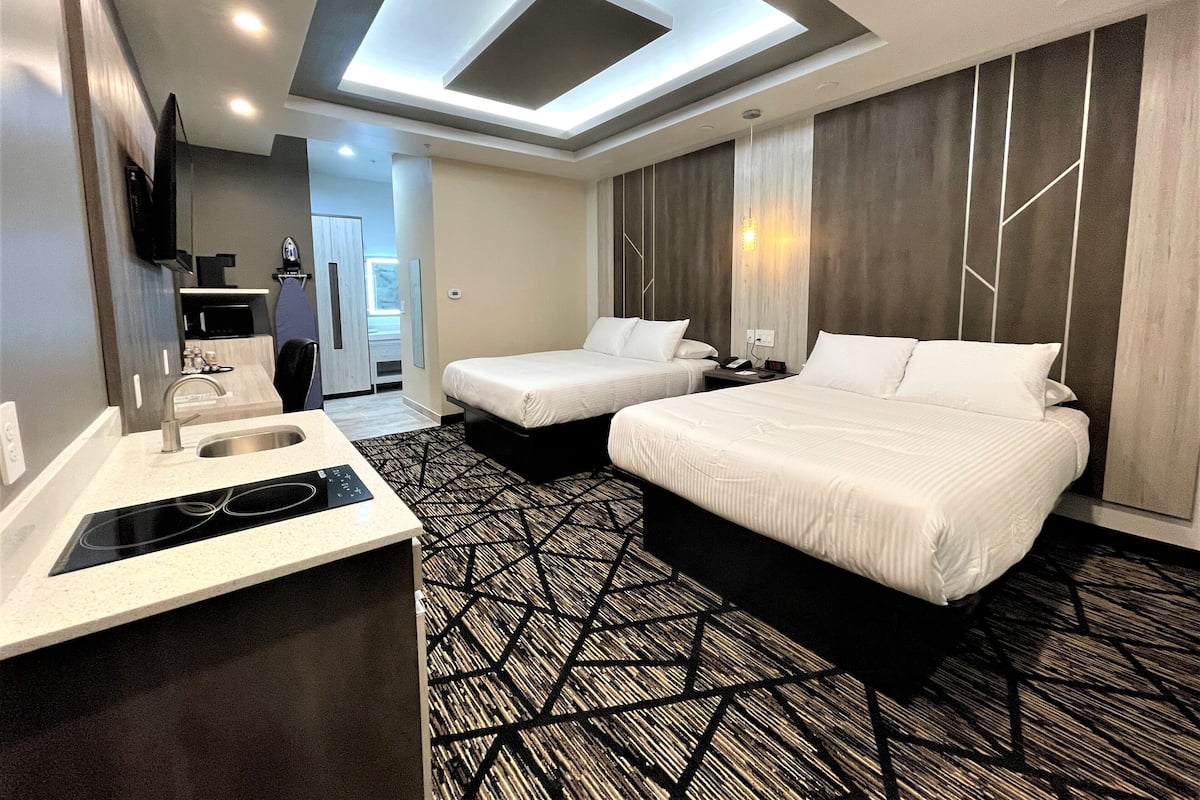 Desk, laptop workspace, blackout drapes, iron/ironing board