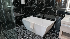 Studio Suite, 1 King Bed, Non Smoking, Hot Tub | Bathroom | Rainfall showerhead, hair dryer, towels