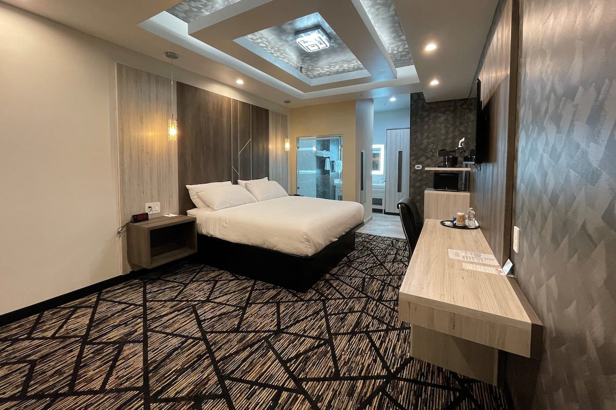 Desk, laptop workspace, blackout curtains, iron/ironing board