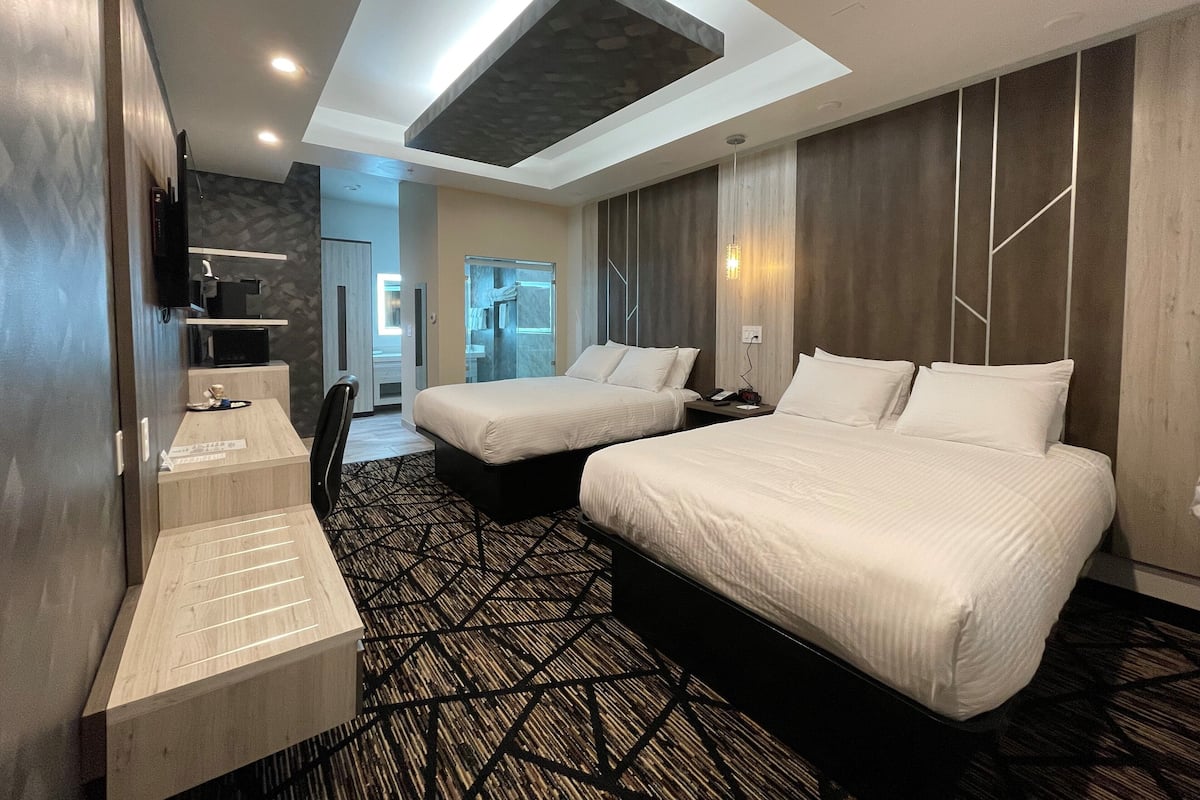 Desk, laptop workspace, blackout drapes, iron/ironing board