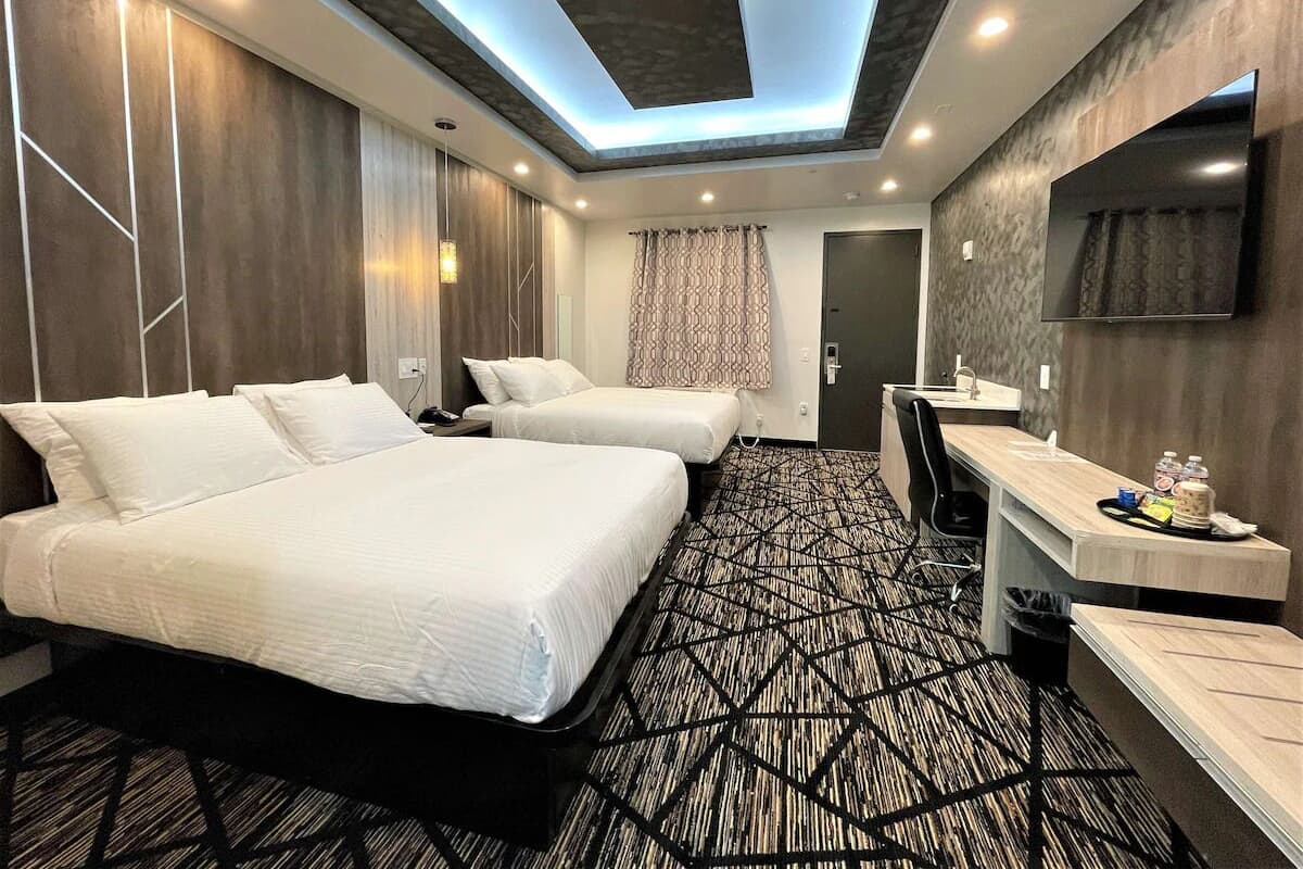 Standard Room, 2 Queen Beds, Non Smoking, Kitchenette | Desk, laptop workspace, blackout drapes, iron/ironing board