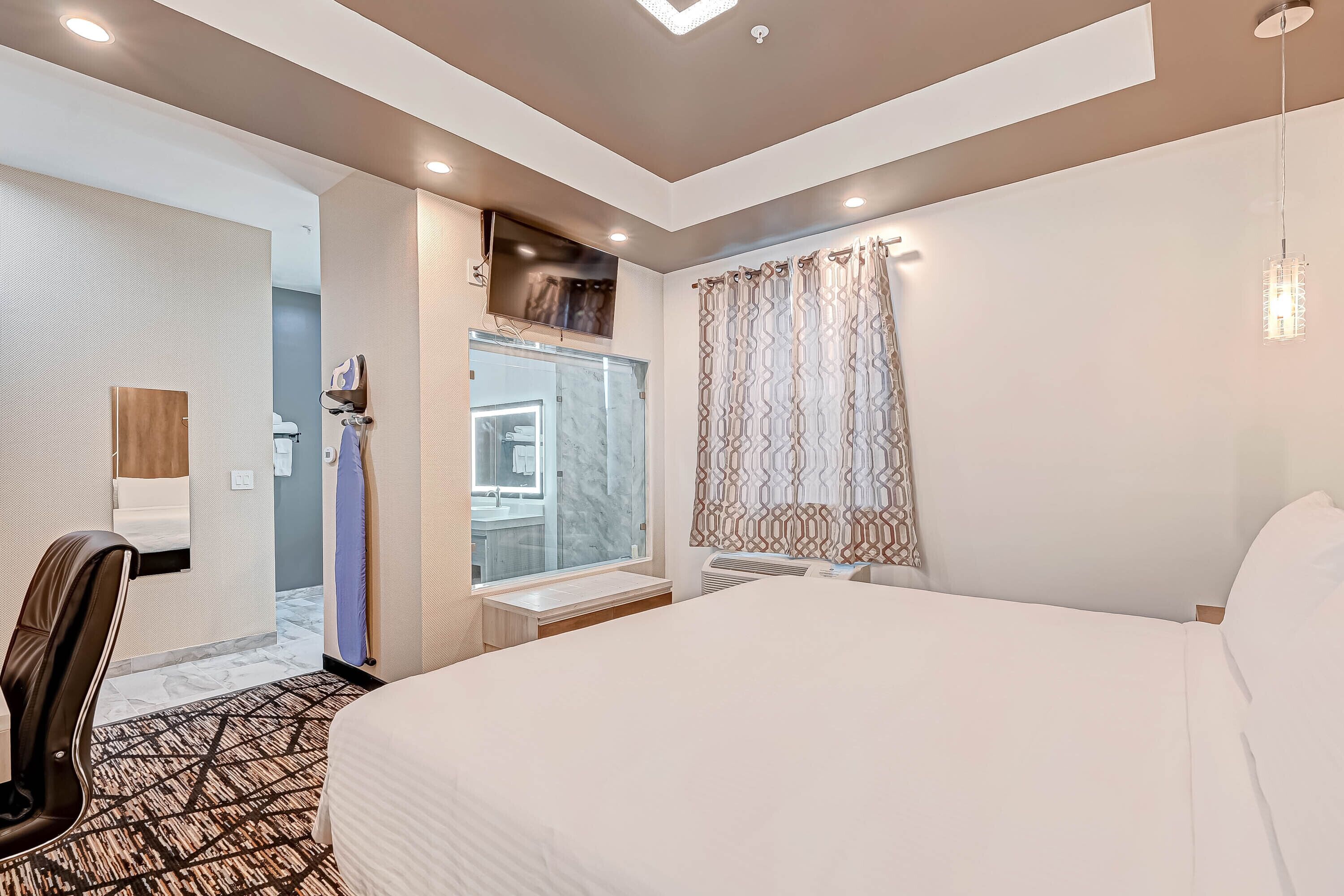 Desk, laptop workspace, blackout curtains, iron/ironing board