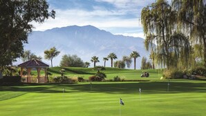 A golf course with a gazebo, palm trees, and mountains in the background. - Marriott Shadow Ridge at Palm Desert, CA (Palm Desert)