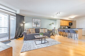 A modern apartment with a living room, a dining area, and a kitchen. - Duke Of York Boutique Suites (Mississauga)