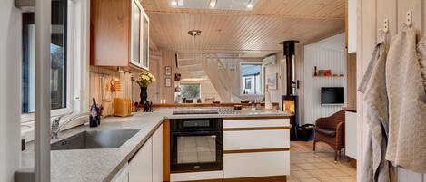 Fridge, stovetop, dishwasher, coffee/tea maker