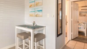 A small bathroom with a white vanity, a mirror, and a sink. - Clean, modern and well-equipped Ocean City condo (Ocean City)