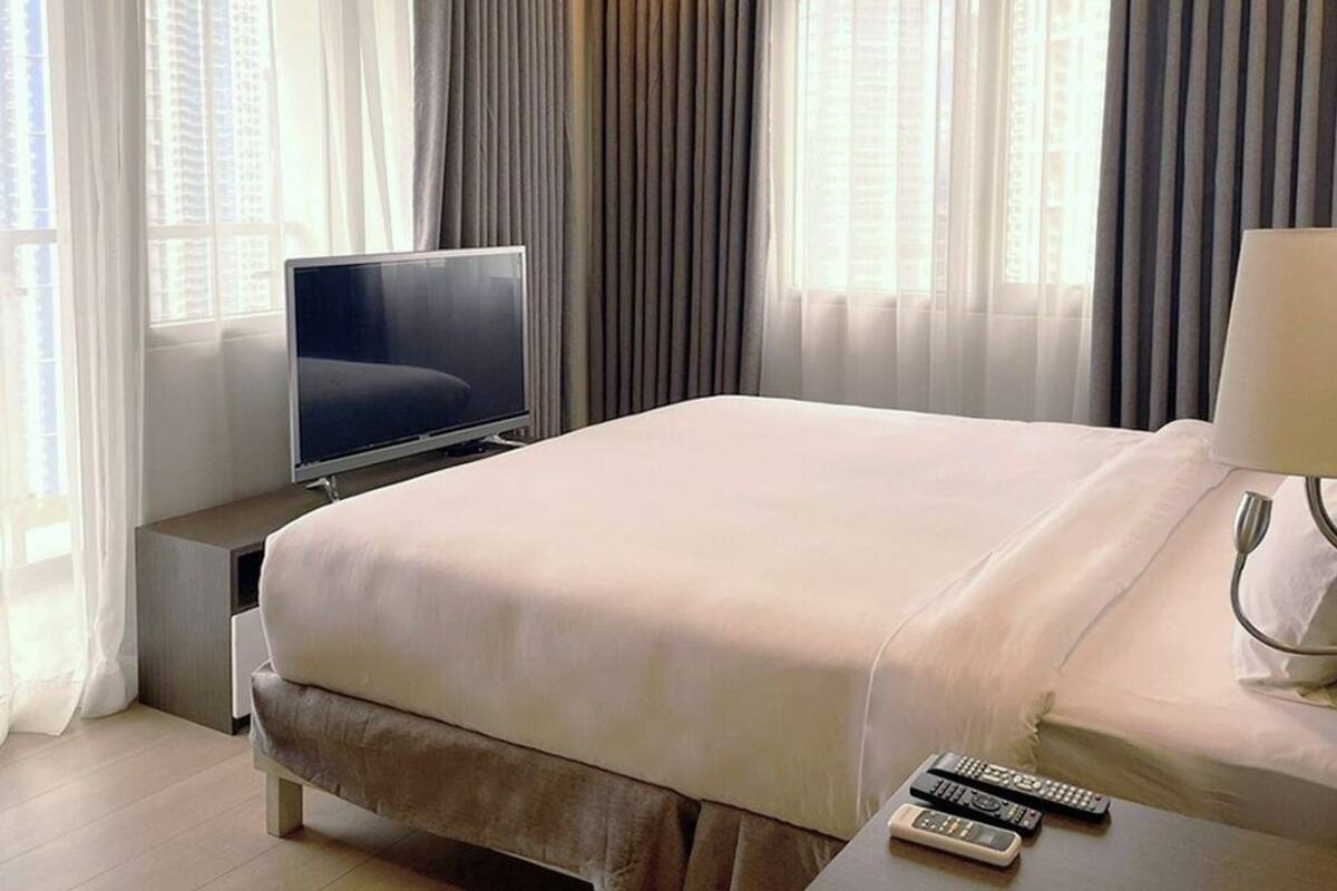 Family Room | Hypo-allergenic bedding, desk, laptop workspace, blackout curtains