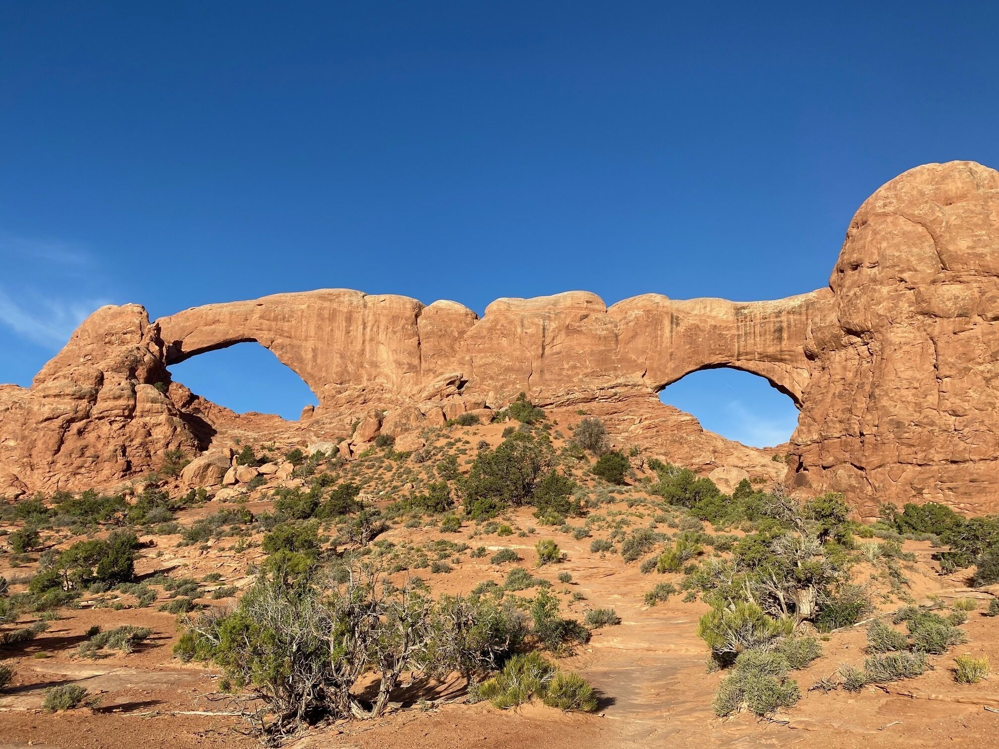 A natural rock formation with two large arches.