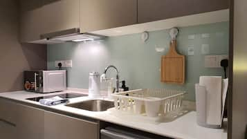 Deluxe Studio Suite, 2 Queen Beds | Private kitchen | Microwave, eco-friendly cleaning products, paper towels