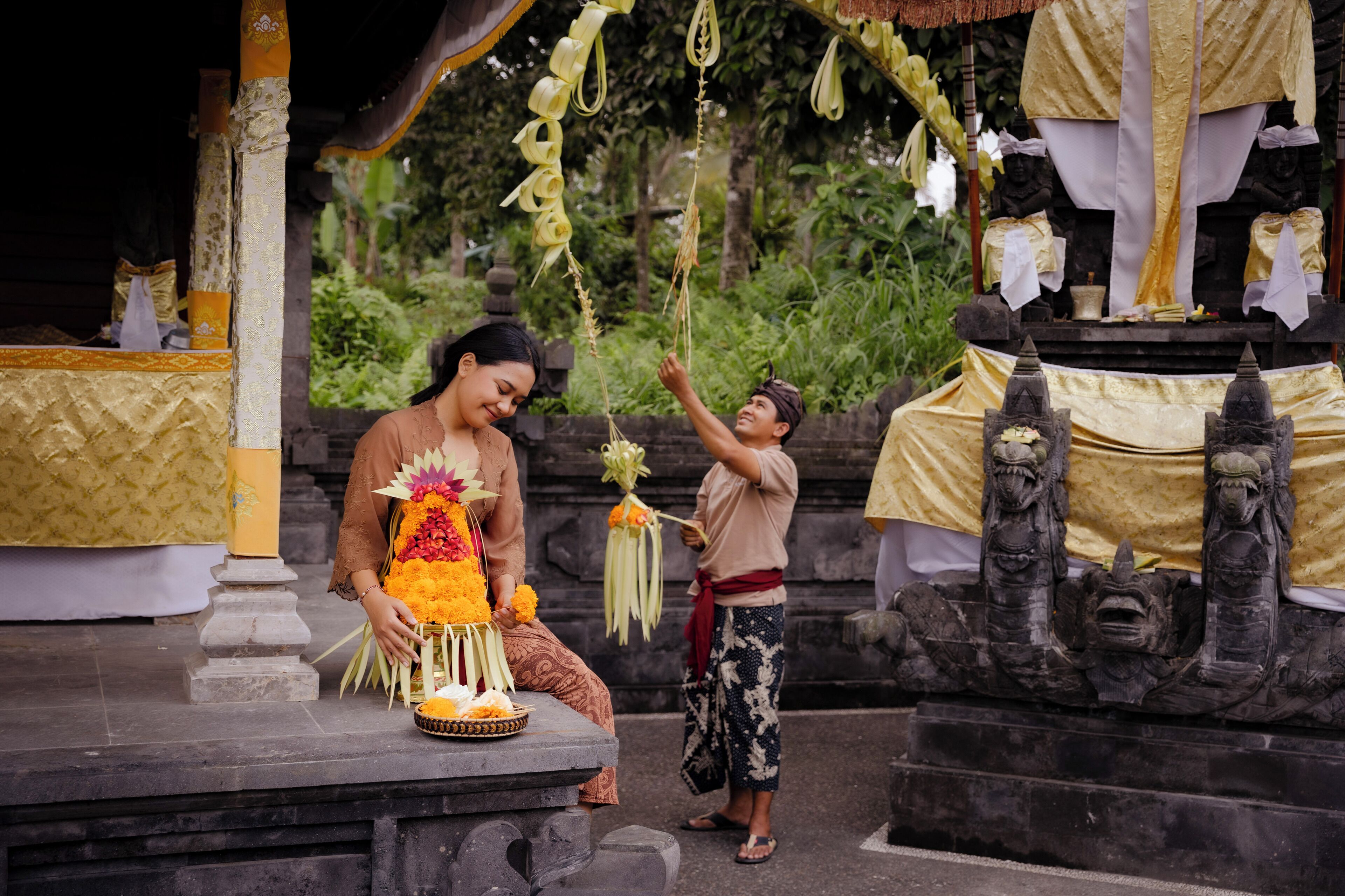 A temple with stone carvings and a statue.
