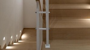 A staircase with wooden steps and a white handrail. - Civitaloft (Civitanova Marche)