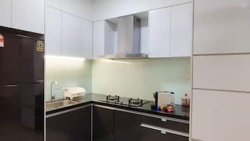 Apartment | Private kitchen | Full-sized fridge, microwave, cookware/dishes/utensils, dining tables