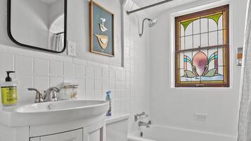 Bathtub, hair dryer, towels