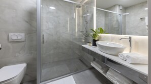Separate tub and shower, free toiletries, hair dryer, slippers