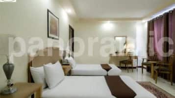 Deluxe driepersoonskamer | Geluiddichte muren, gratis wifi, beddengoed