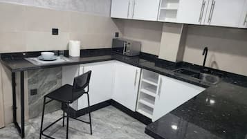 Fridge, microwave, coffee/tea maker, electric kettle