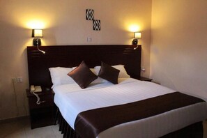 Frette Italian sheets, premium bedding, down comforters, in-room safe