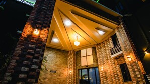 A building with a reception area, a staircase, and a balcony. - BON HOTEL PLATINUM (Enugu)