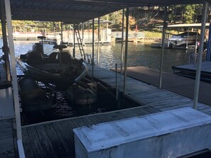 Moored at the marina, this boat offers a serene waterfront experience.