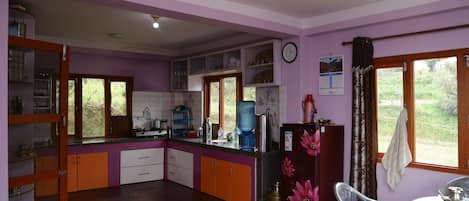Fridge, cookware/dishes/utensils, dining tables