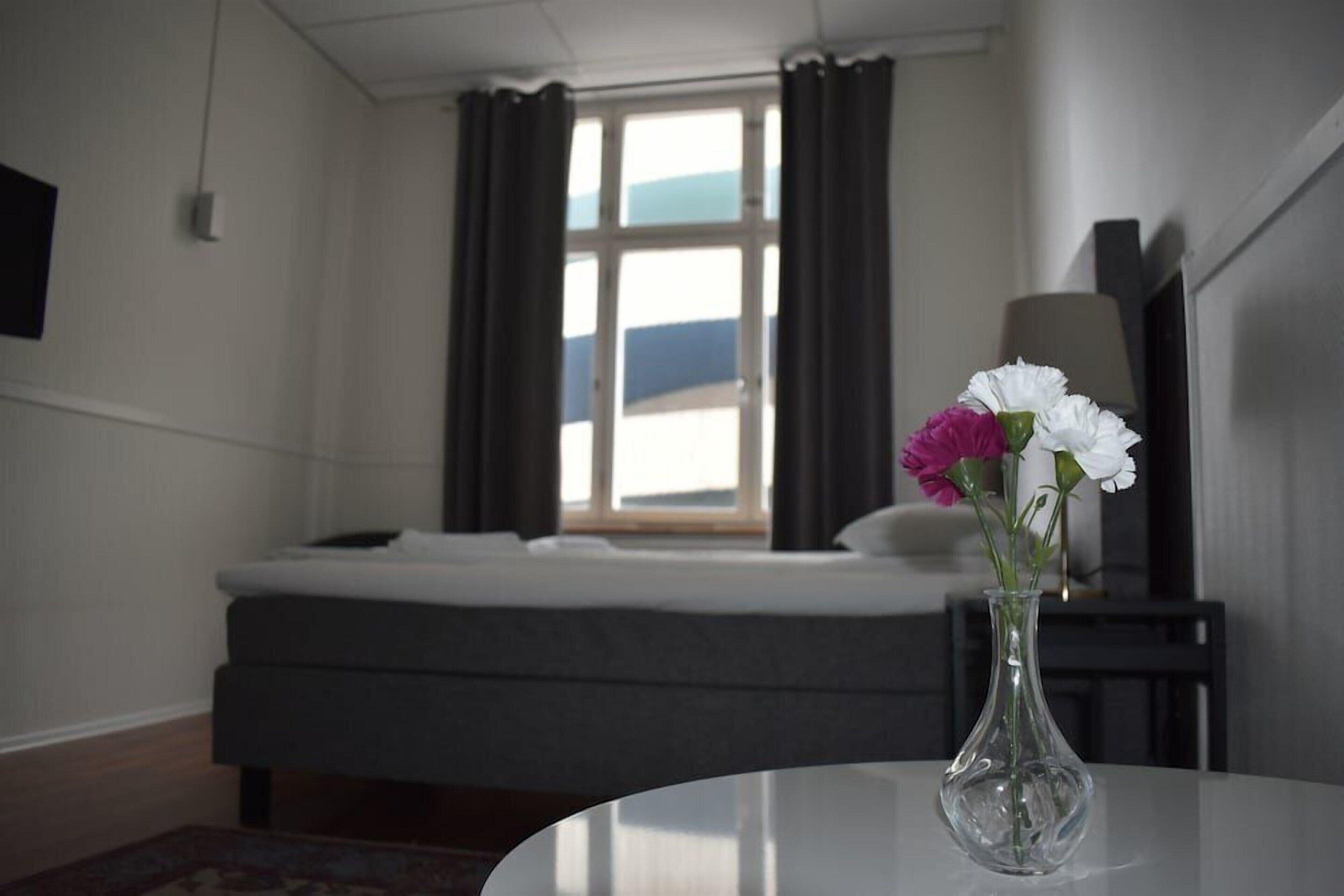 Premium bedding, blackout drapes, free WiFi, bed sheets