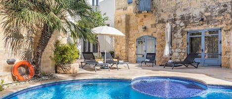 Seasonal outdoor pool, pool umbrellas, pool loungers