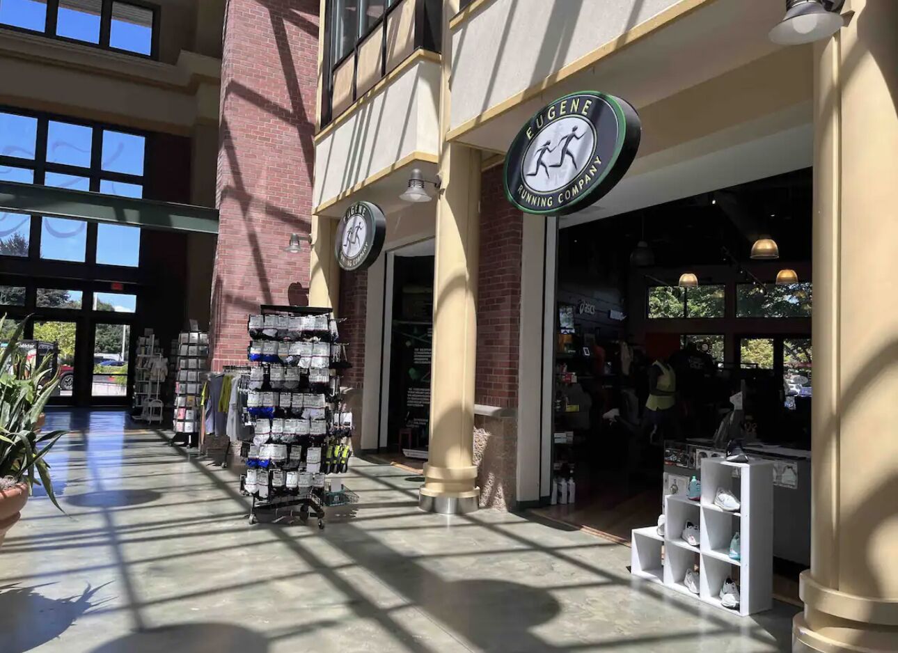 A store with a sign reading "Eugene Tuning Company" and a display of shoes.