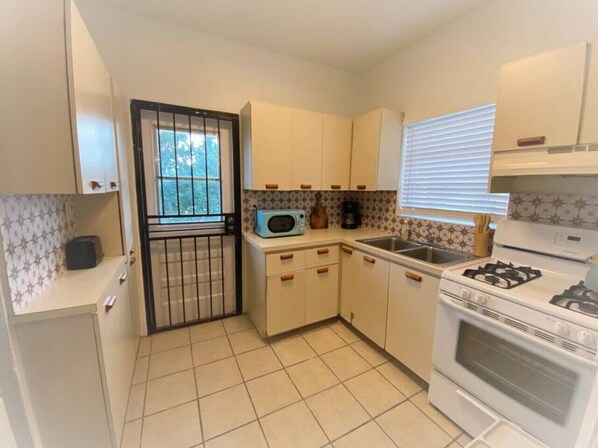 Fridge, coffee/tea maker, cookware/dishes/utensils