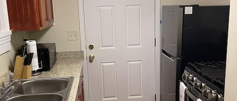 Fridge, microwave, stovetop, coffee/tea maker