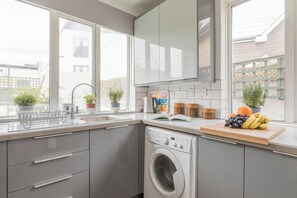 Fridge, microwave, oven, dishwasher - Tideway is a spacious three-bedroom house boasting private parking and the beach on your doorstep. (Whitstable)