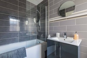 Bathtub, hair dryer, towels