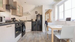 Coffee/tea maker, fridge, microwave, oven - The Old Bakery is a charming two-bedroom cottage located in the heart of Whitstable. (Whitstable)