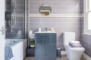 Bathtub, hair dryer, towels