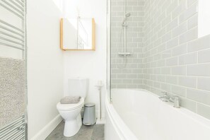 Bathroom with shower over bath, WC & basin - Goldfinch Cottage sleeps six guests comfortably and is located just a stone's throw from the Harbour. (Whitstable)