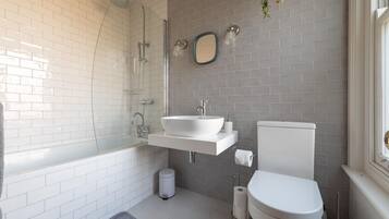 Bathtub, hair dryer, towels