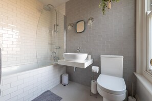 Bathtub, hair dryer, towels