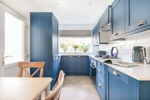 Fridge, microwave, oven, stovetop - Eden Cottage sleeps six and is decorated with a relaxing vibe very close to the town & beach. (Whitstable)
