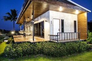 A modern house with a covered porch, a door, and a number 602 on the wall. - White Knot Khao Yai (Pak Chong)