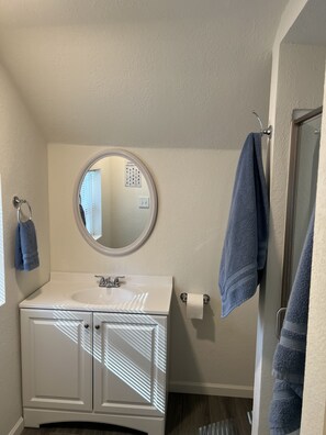 Shower, hair dryer, towels, soap