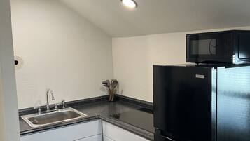 Fridge, microwave, stovetop, coffee/tea maker